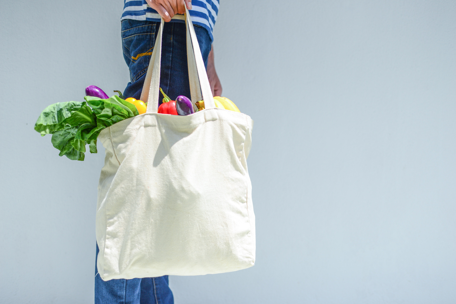 Asian Man with reusable grocery bag